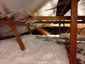 Attic insulation with wooden attic beams